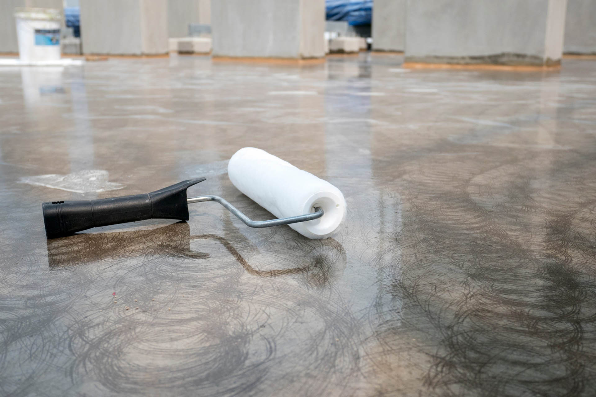 epoxy topcoat on concrete floors with paint roller